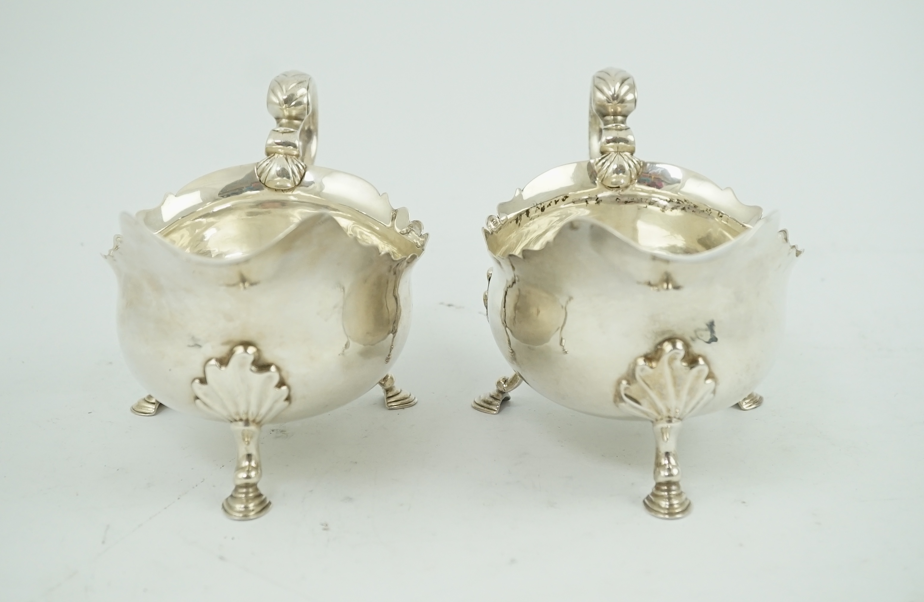 A pair of late George II silver sauceboats by Robert Albin Cox